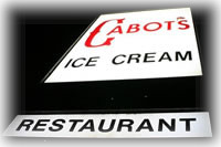 Cabot's exterior sign by night